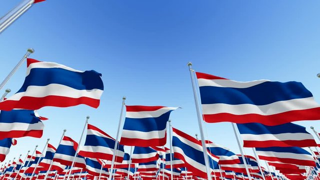 Flags of Thailand on flagpoles against blue sky. Three dimensional rendering 3D rendering animation.