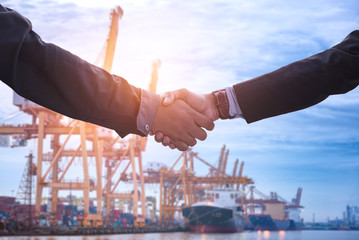Business collaboration shake hands and abstract blur transportation import export background