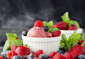 fruit ice cream with fresh strawberries, blueberries and raspberries