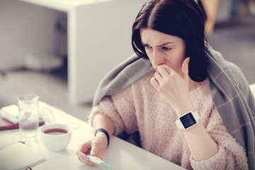 Depressed sad woman suffering from a cold