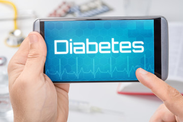 Smartphone mit dem Text Diabetes auf dem Display