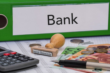 Aktenordner (grün) mit Beschriftung Bank
