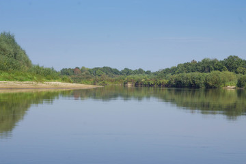 Wild nature of Belarus / Landscape of forest and river with reflection 