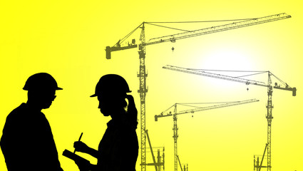  silhouette portrait of engineer Work order in construction site on colorful light sunset.