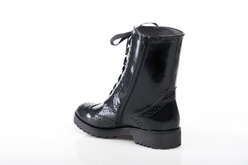 Black suede boot isolated on white background.