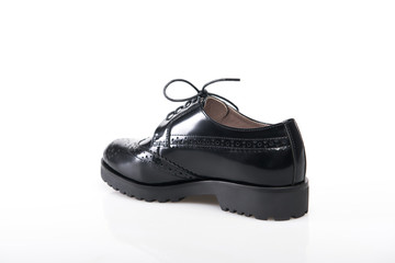 Black suede shoe isolated on white background.