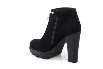 Black suede boot isolated on white background.