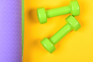 Shaping and fitness equipment. Barbells in small size, close up