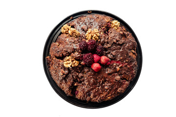 Fresh baked pecan pie isolated on white, a European style dessert made with a chocolate shortbread crust