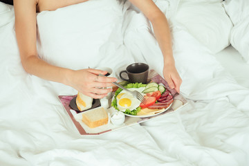 woman close-up of breakfast in bed
