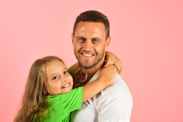 Daughter and father hug each other. Schoolgirl and her dad