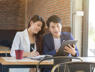 Asian business man and asian business woman.