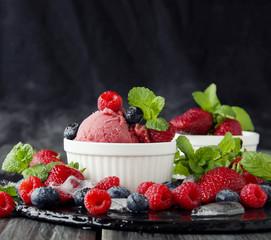 fruit ice cream with fresh strawberries, blueberries and raspberries