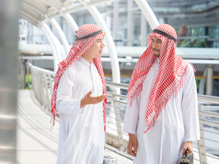 Greeting and talking of arab businessman in the modern city, successful, happy, good feeling,...
