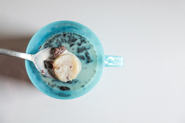 Pile of brownies with milk and banana