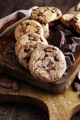 Chocolate cookies on wooden table. Chocolate chip cookies shot