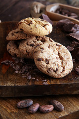 Chocolate cookies on wooden table. Chocolate chip cookies shot