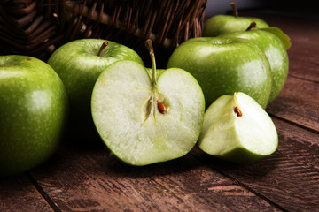 Fresh Ripe green apples on wooden background