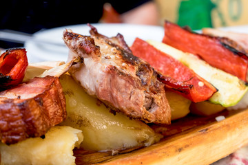 Serbian dish known as rostilj include grilled pork neck, beef steak and bbq vegetables 