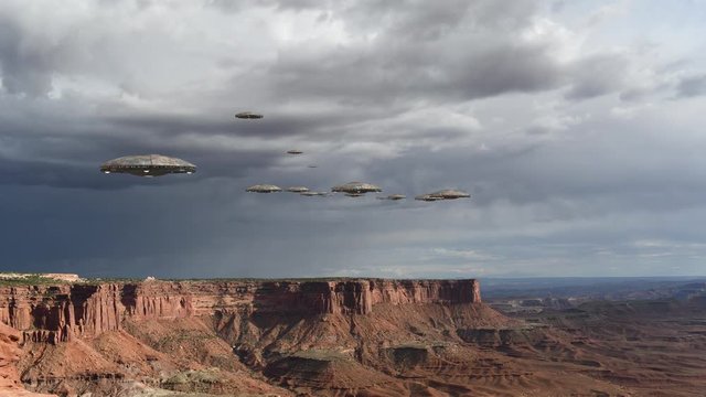 Loop of alien spaceships flying above the Grand Canyon, in Canyonlands National Park, Utah, USA, for futuristic, fantasy and interstellar travel or war game backgrounds.