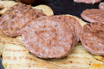 Serbian dish known as rostilj include grilled pork neck, beef steak, pleskavica, cevapi, sausages and are served with homemade buns and tortillas