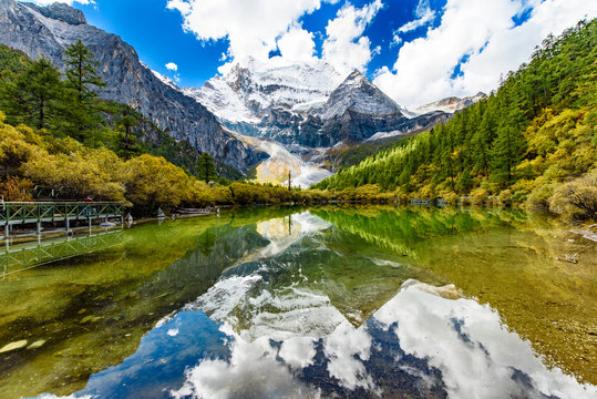 Mount  Chenrezig(Xiannairi) with the reflection in the Pearl Lake in Yading,Daocheng,China.