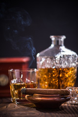 Obraz na płótnie Canvas Cuban cigar smoking in wooden ashtray