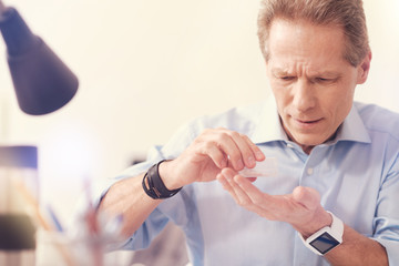 Sick office worker taking pills