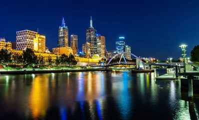 A beautiful view of Melbourne downtown across the Yarra river at night in Melbourne, Victoria, Australia.