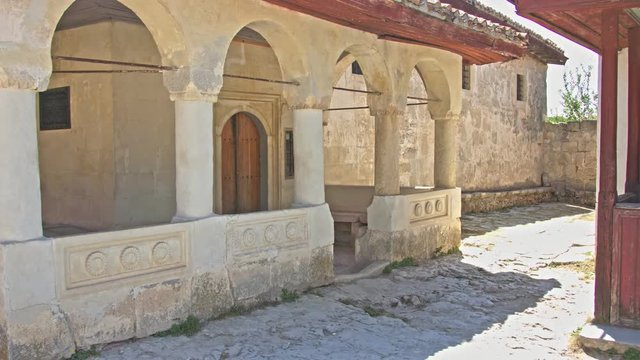 The courtyard of an ancient house with antique columns.