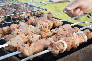 BBQ meat on skewers in grill