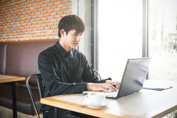 Businessman working in coffee shop