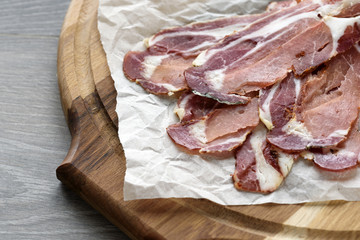 Spanish hamon ready for eat ovet the wooden background
