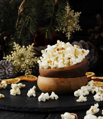 Fototapeta na wymiar New Year or Christmas composition with popcorn, hazelnuts