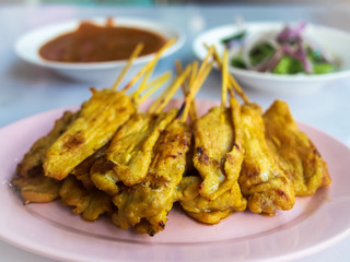 close up, Pork satay with peanut sauce on dish