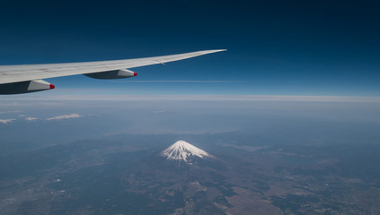 A view from the airplane window while flying over Mt. Fuji..
