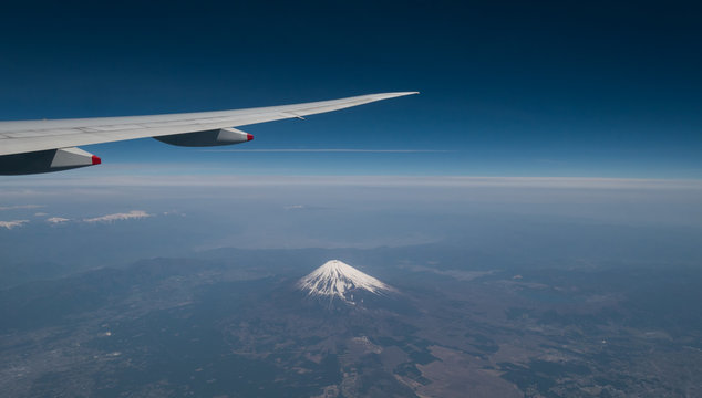 A view from the airplane window while flying over Mt. Fuji.. - Powered by Adobe