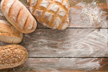 Bread background with copy space on rustic wood