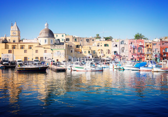 Port with colorful old houses of Procida island, Italy, retro toned - obrazy, fototapety, plakaty