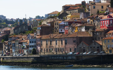 Fototapeta na wymiar The beautiful view over Porto in Portugal. Amazing colorful buildings in the city 