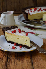 Vanilla cheesecake on chocolate shortbread dough. Cheese pie. Homemade baking.