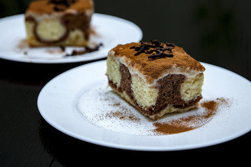 piece of cake on a plate on a dark background