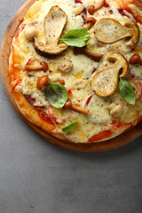 Fresh pizza with mushrooms above
