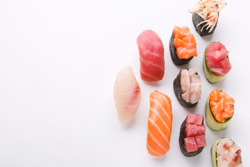 Sushi and maki isolated at white background, top view