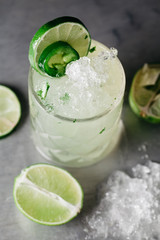 Summer alcoholic cocktail  with crushed ice garnished with limes