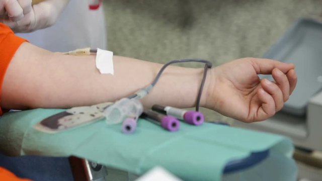 Blood donation hand. Nurse hands