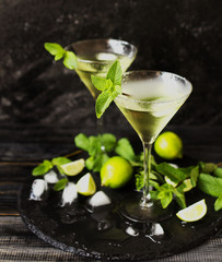 Martini or mint liqueur with lime, selective focus
