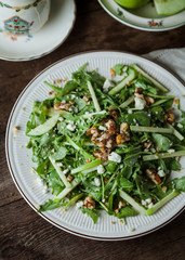 A gourmet salad on rustic surface, vertical, top view