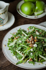 A gourmet salad on rustic surface, vertical, top view