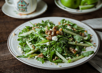 A gourmet salad on rustic surface, horizontal